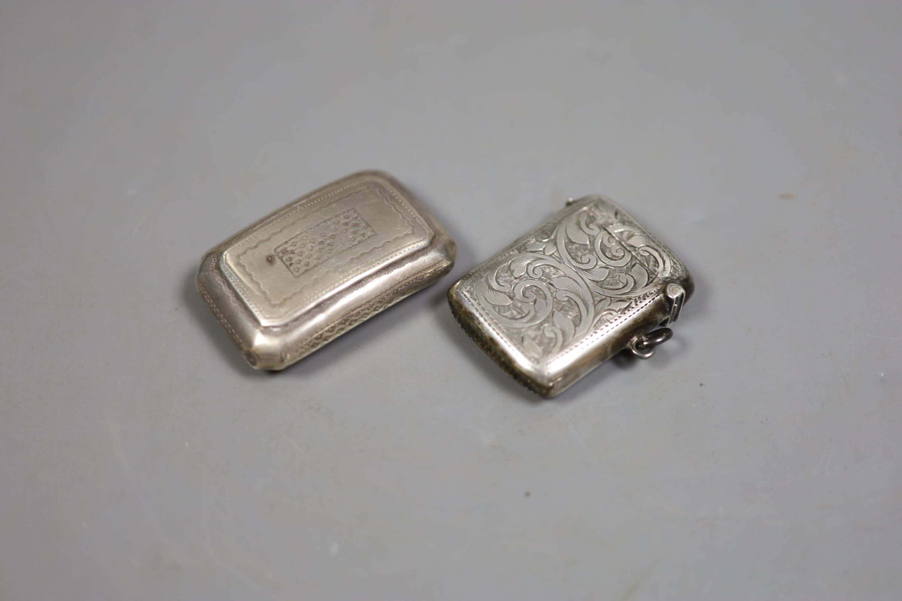 A George III silver curved snuff box, Birmingham, 1813, 52mm, a silver vesta case and two metal pill boxes